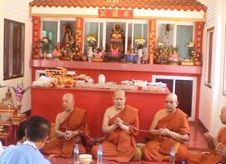 Buddhist monks attend the ceremony in Rong Poh as residents there prayed for prosperity and protection from the Sea God.